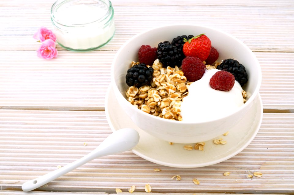 Red Strawberry And Raspberry On White Ceramic Bowl