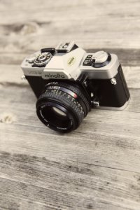 Minolta Camera On Wooden Surface photo