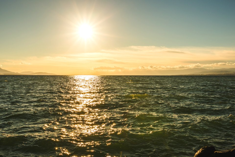 Green Sea Under Blue Sky During Day Time