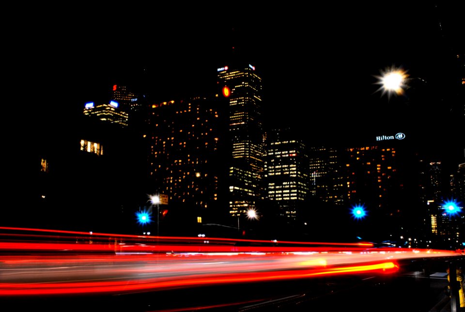Time Lapse Photography Of Red And Orange Taillight In City During Daytime