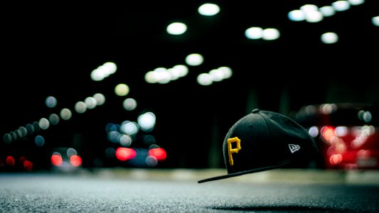 Black And Yellow P Cap Hanging In The Air