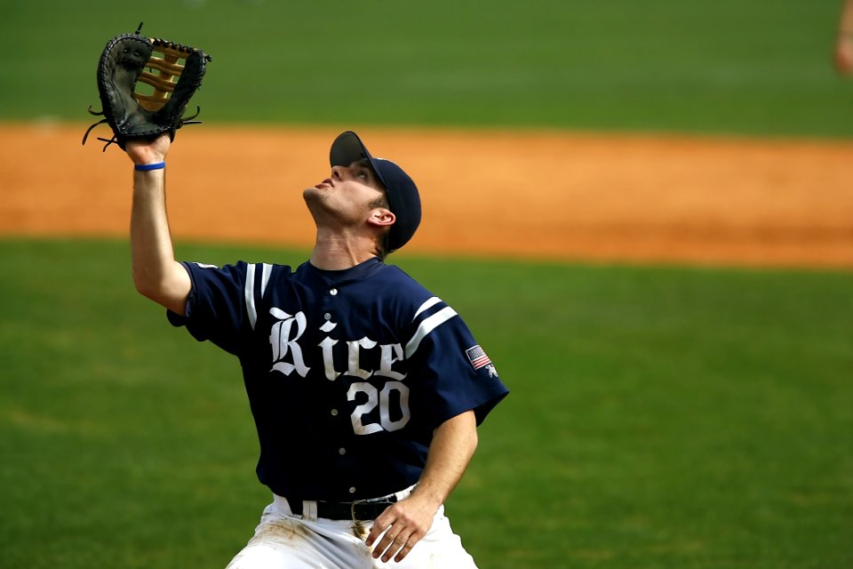Man In Blue And White Rice 20 Jersey Looking Up During Daytime