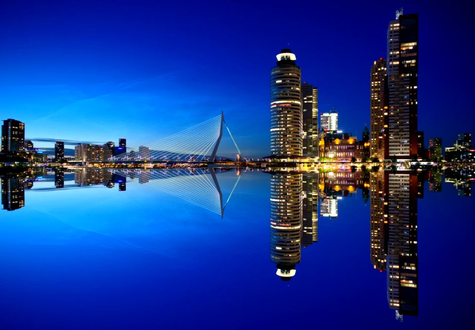 Mirrored Image Of High Rise Buildings And Bridge