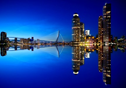 Mirrored Image Of High Rise Buildings And Bridge photo