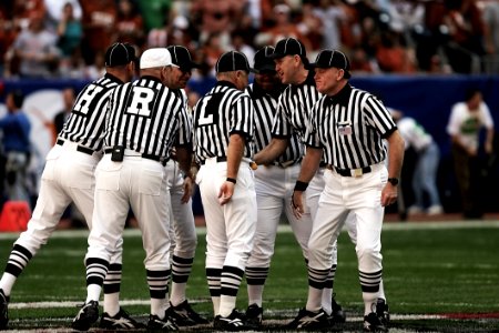 8 Football Referees In The Field photo
