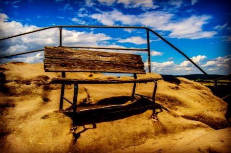 Brown Wooden Bench On Brown Sand photo
