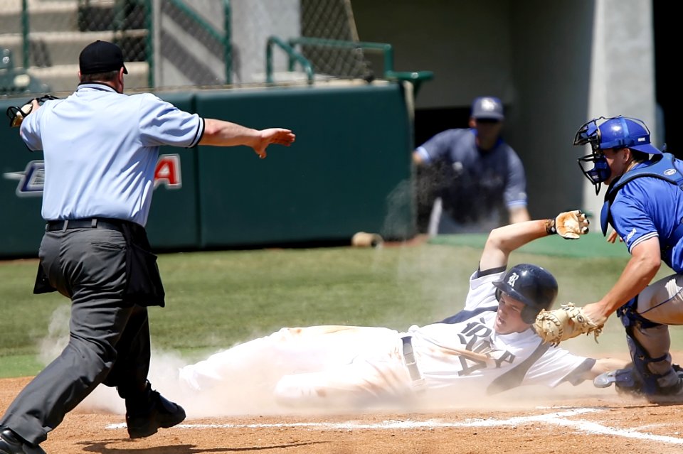 Man With White T Shirt Running To Baseball Home