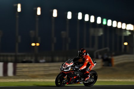 Person Riding Super Bike During Night Race