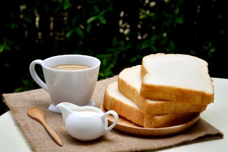 3 Sliced Loafs Beside White Ceramic Coffee Cup photo