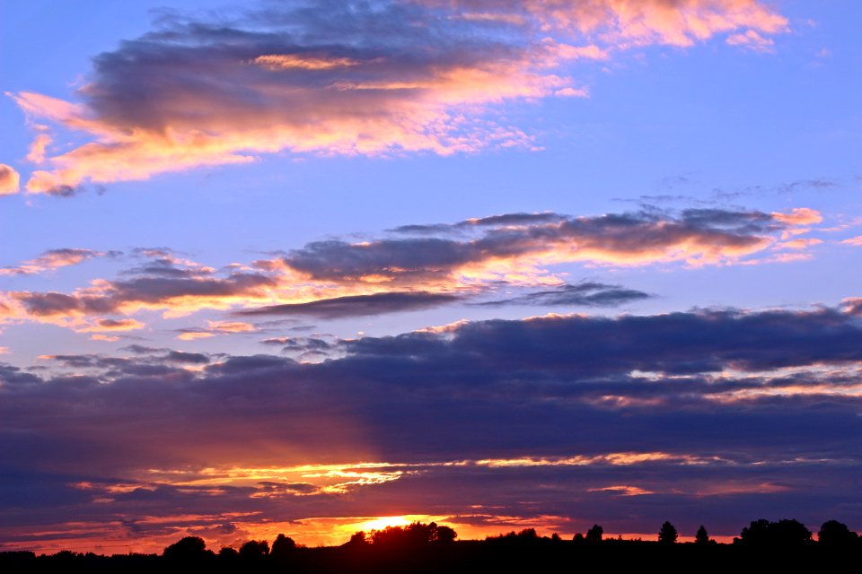 White Clouds And Blue Sky During Golden Hour
