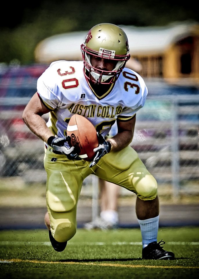 Austin College Football Player Running With Football