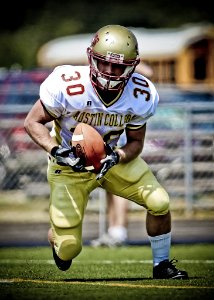 Austin College Football Player Running With Football