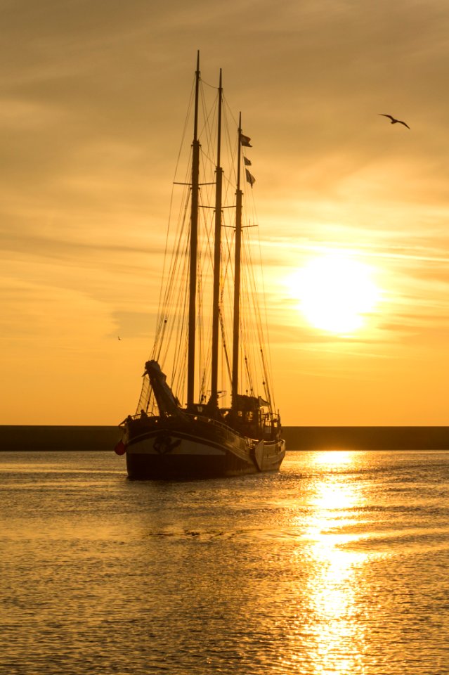 Sailboat At Sunset
