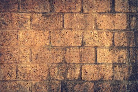 Brown And Black Brick Wall Close Up Shot Photography photo