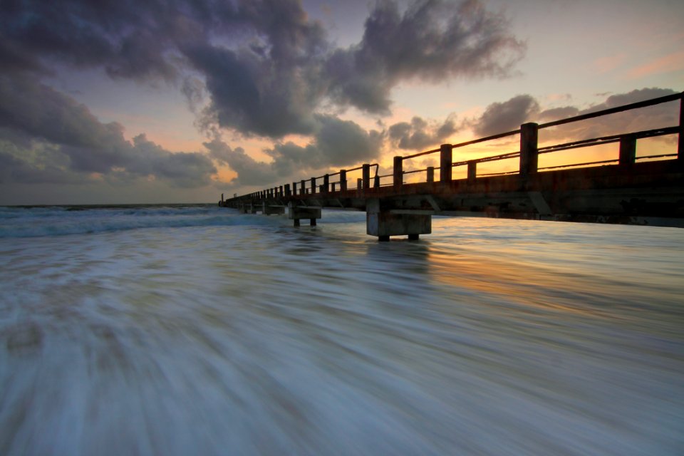 Brown Wooden Fishing Dock On Ocean