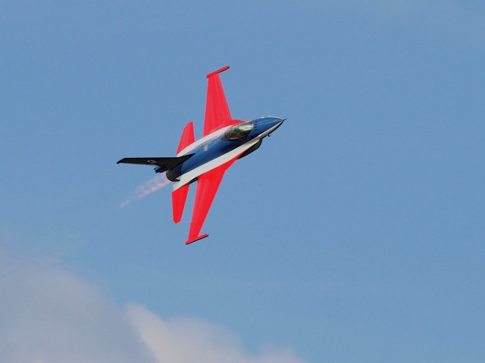 Blue Red Black And White Jet Plane On Air