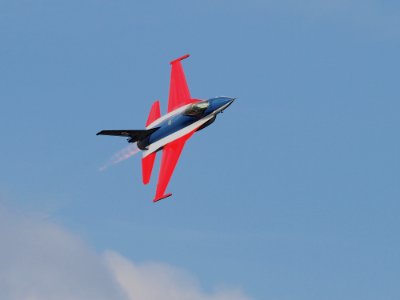 Blue Red Black And White Jet Plane On Air photo