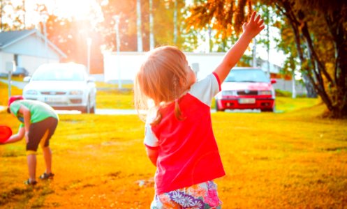Girl Playing In Yard