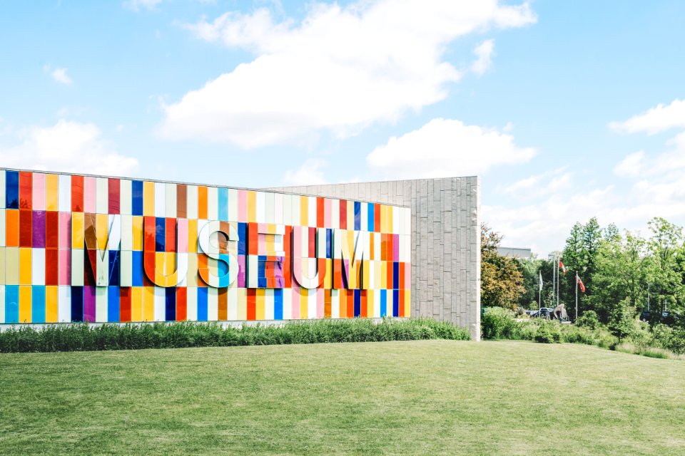 White Red And Blue Museum On Green Grass