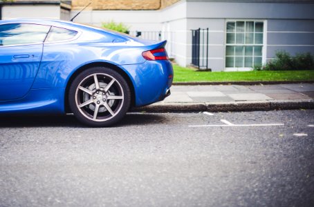 Blue Car Parked Near Grey And White Painted House