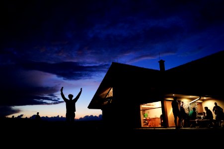 Silhoutte Of Person Standing During Night Time photo