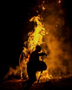 Person Silhouette Near The Fire
