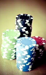 Red Black Green Blue And White Poker Chips photo