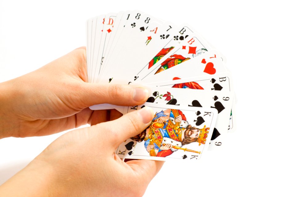 Person Holding Playing Cards