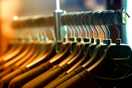 Pile Of Shirts Hanged In Shirt Rack photo