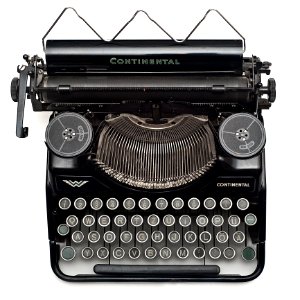 Black Continental Typewriter On White Surface photo