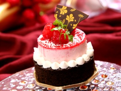 Chocolate Cake With White Icing And Strawberry On Top With Chocolate photo