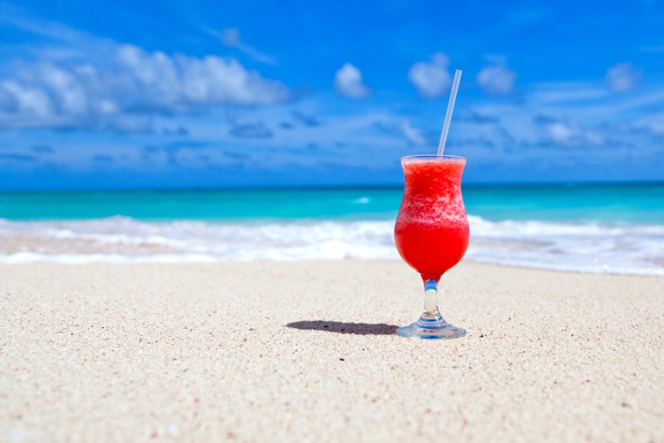 Red Slush Drink In Glass On Beach photo