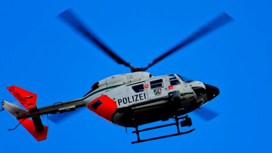 Photography Of Red White And Blue Helicopter