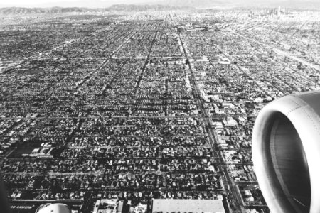 Aircraft Flying Over City photo