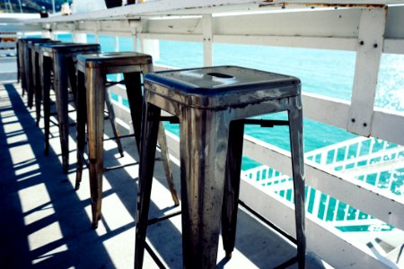 Row Of Stool By Water