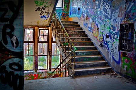 Graffiti Wall With Wrought Iron Donwstairs photo