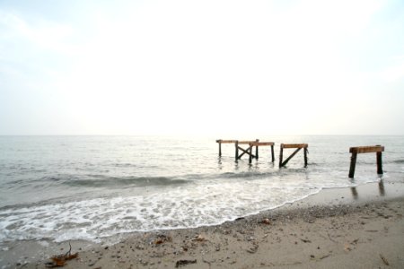 Piles On Sandy Beach photo