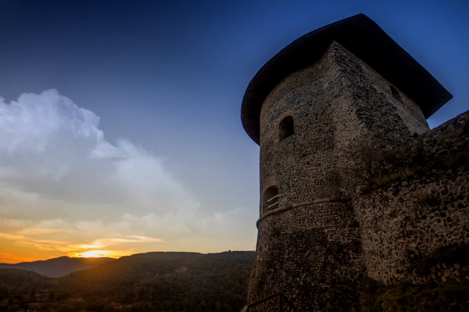 Photograph Of Brown Temple Near Mountains During Sunset