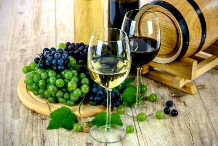 Clear Wine Glass Near Green Grapes photo