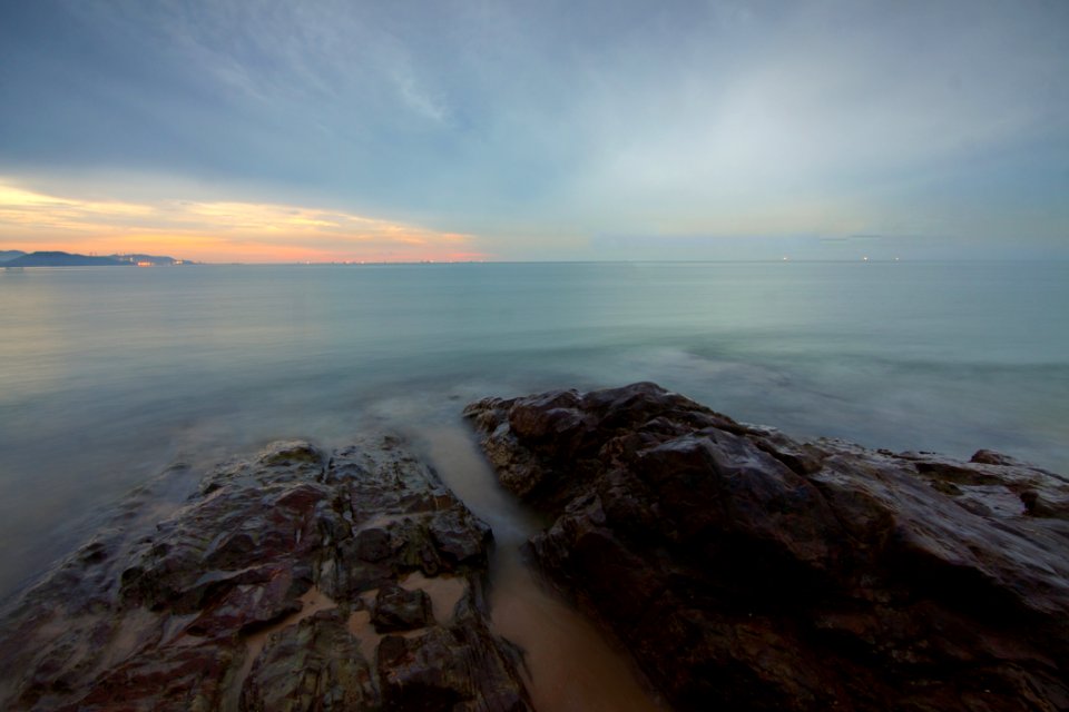 Rock Formation Surrounded By Sea During Daytime