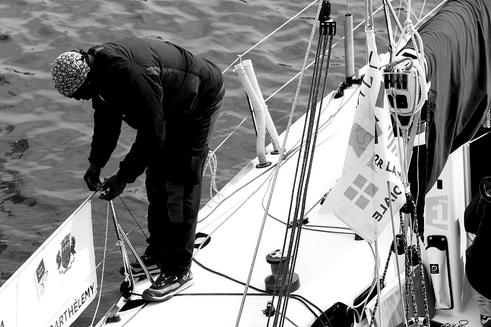 Man In Black Gray Jacket On A Boats Railing