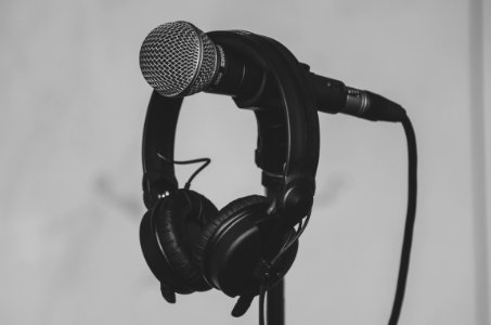 Black Headset Hanging On Black And Gray Microphone photo
