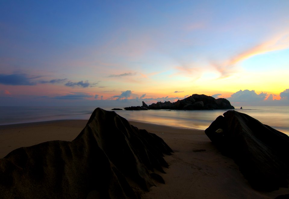 Island On Sea Under Blue Sky At Golden Hour