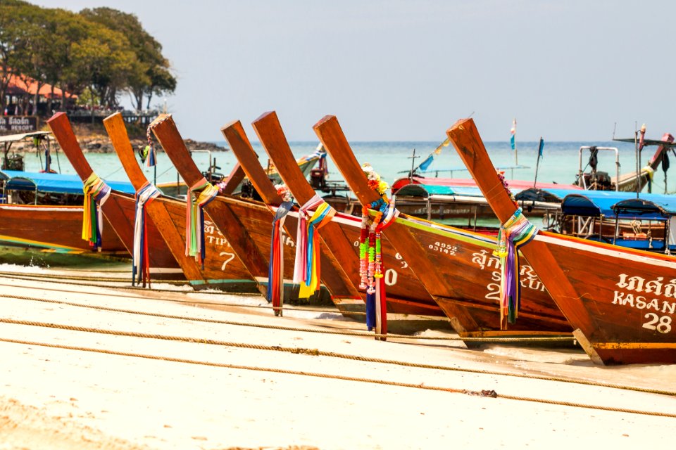 Brown Wooden Docked Boat At Daytime