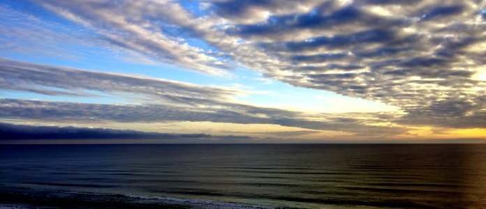 White Sky Under Blue Sea During Dawn photo