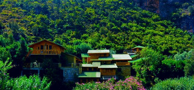 Brown And Green House In Mountain During Daytime photo