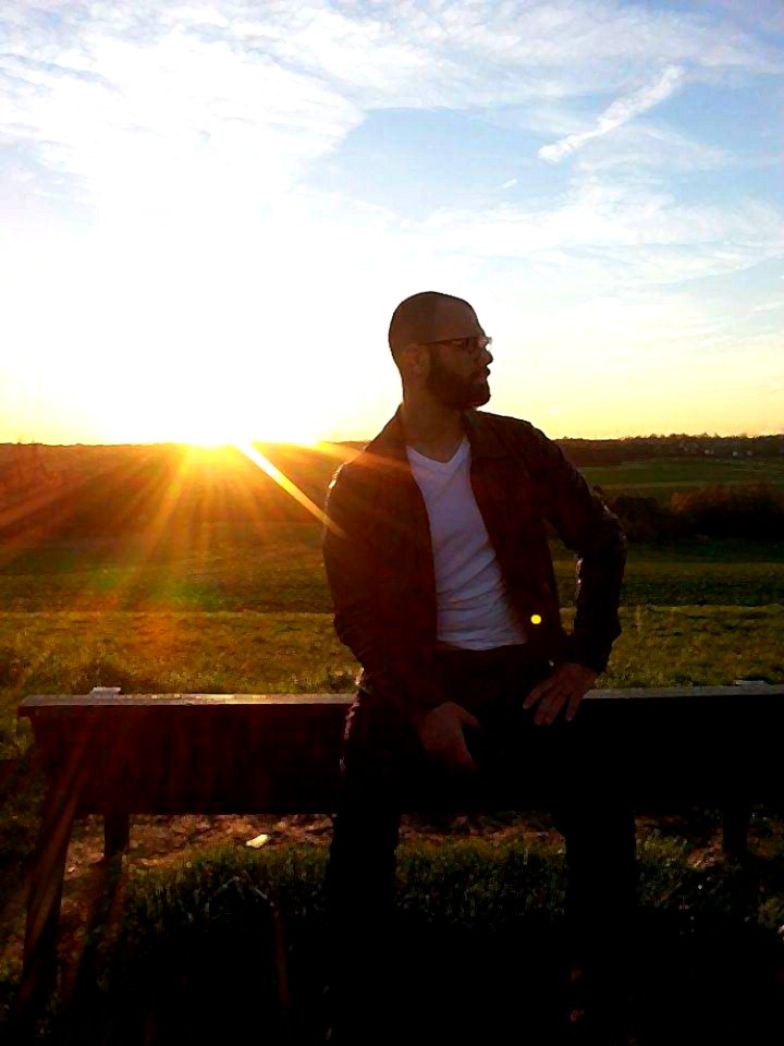 Man On Country Fence At Sunset photo