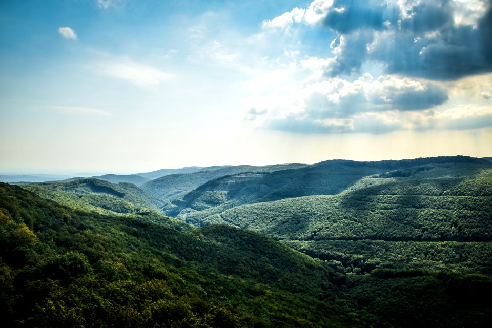 Green Tree Coated Mountain Under White And Blue Cloudy Sky At Daytime