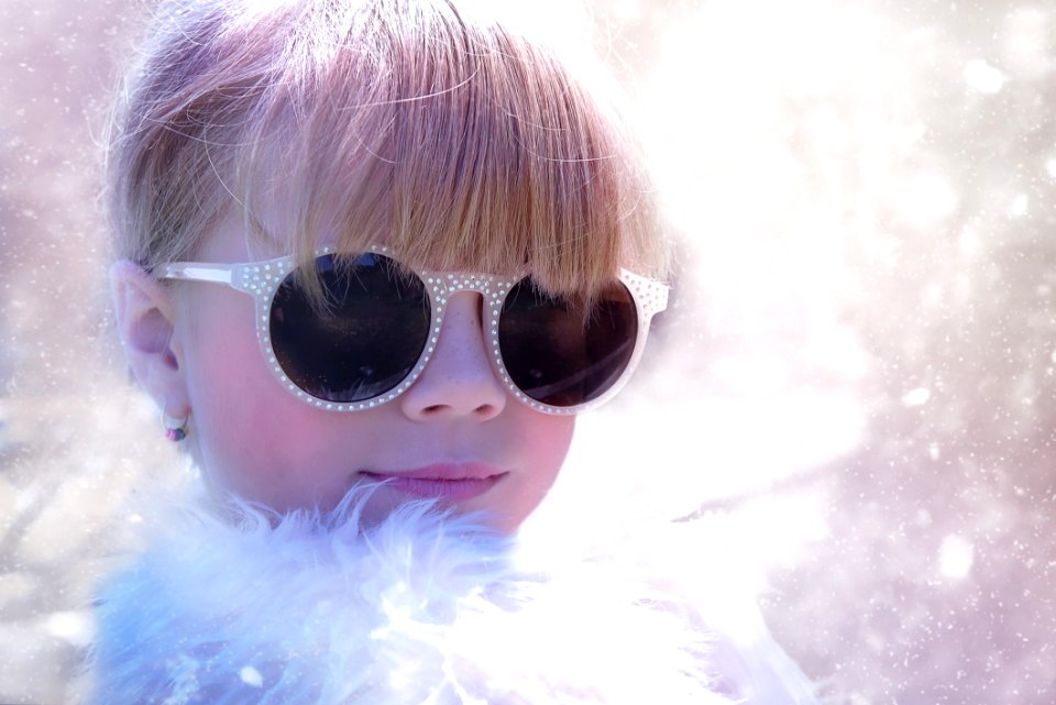 Woman With Sunglasses In White Fur Shirt