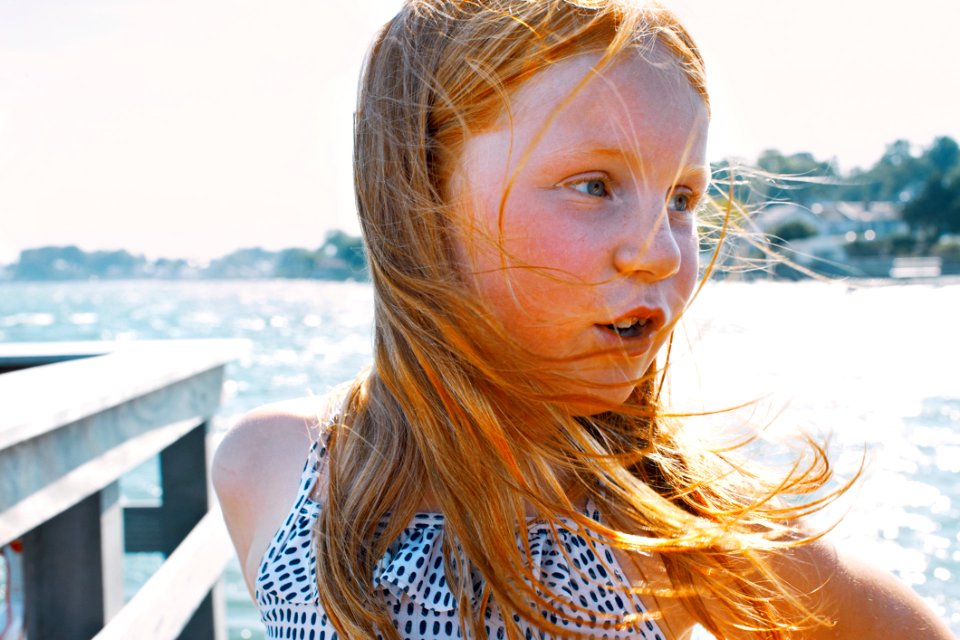 Blond Girl On Waterfront